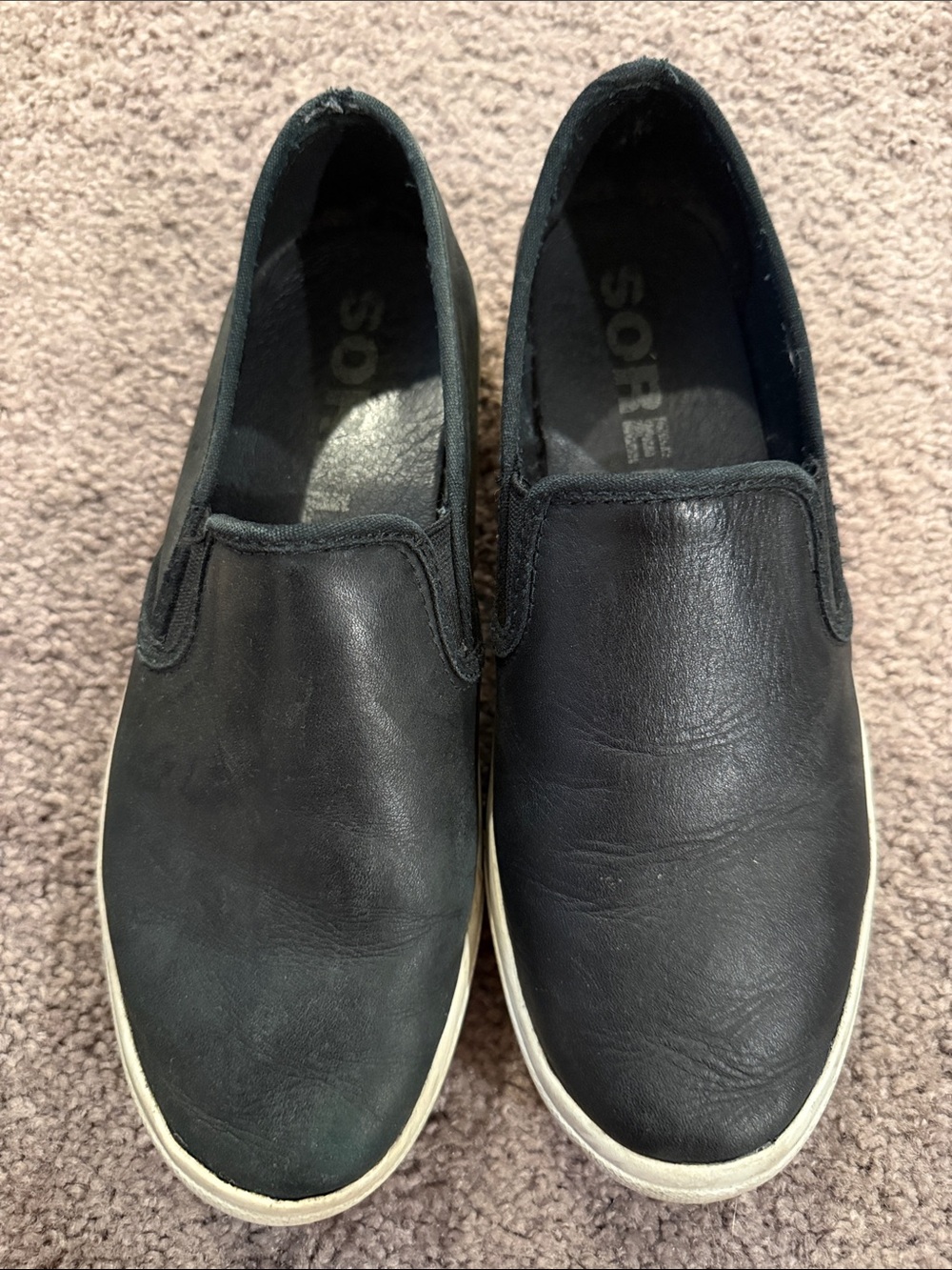 Sorel Women’s Black Leather Slip-On Sneakers with White Sole